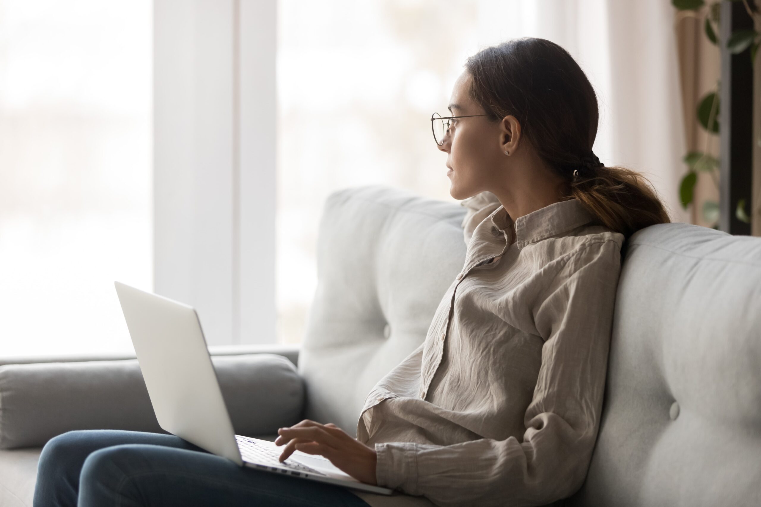 A person on a computer getting telehealth treatment.